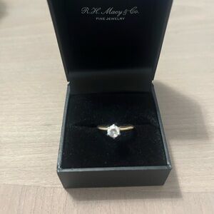 Gold and white ring the stone is sircone